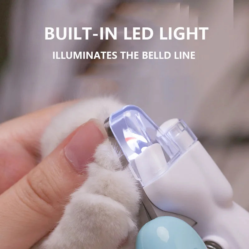 Pet nail clipper with built-in LED light being used on a pet's paw.